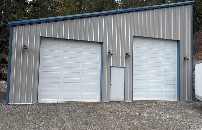 Finished Griffin single-slope metal shop with two overhead doors